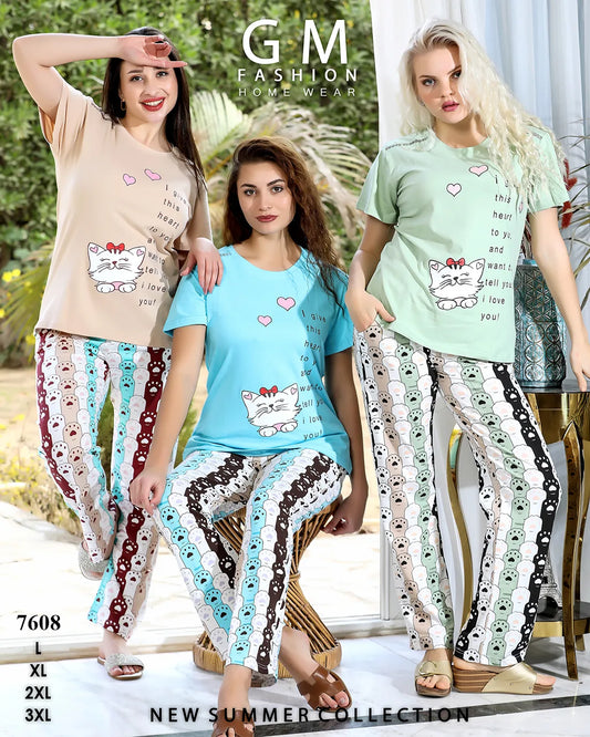 Three women wearing matching pajama sets with cat designs, standing in a home setting.