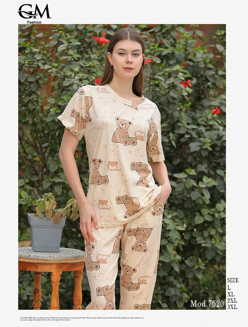 Woman wearing a pajama set with teddy bear pattern outdoors