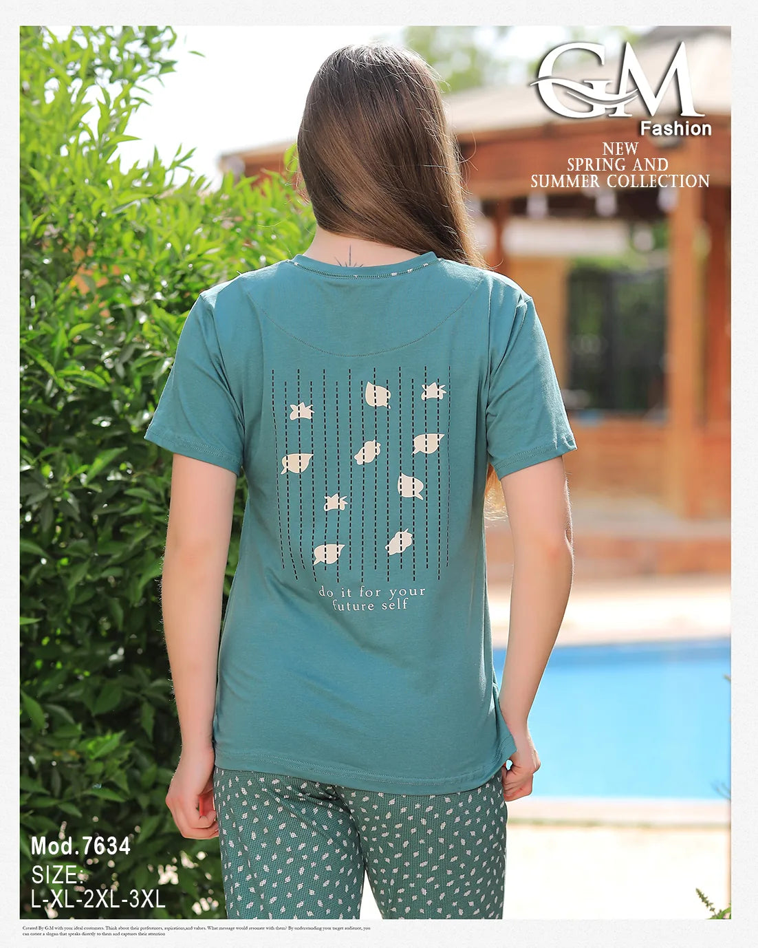 Person wearing a teal t-shirt with floral patterns outdoors near a pool