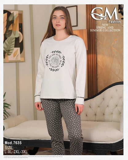 Woman wearing a white long-sleeve top and patterned pants with 'GM Fashion' branding.