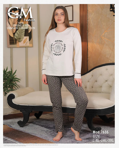 Woman wearing a white sweatshirt and patterned pants in a living room setting with 'G&M Fashion' branding.