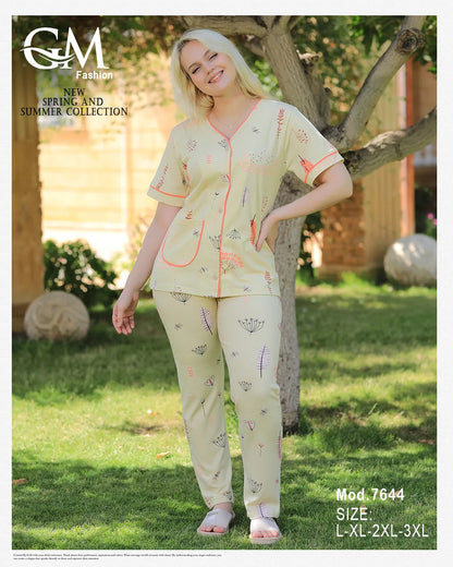 Woman wearing a light-colored outfit with floral patterns in a garden setting, featuring 'GM Fashion' branding.