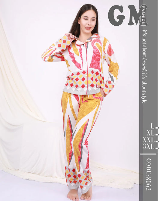 Woman wearing a colorful outfit with geometric patterns on a white background, featuring the brand 'GM'.