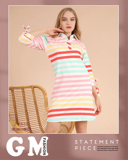 Woman wearing a colorful striped dress with 'GM Fashion' branding on a beige background